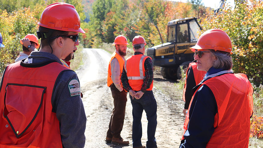 Diane Rowland, dean of the college, talks with Maine Forest Service District Forester Jim Ferrante during the tour.