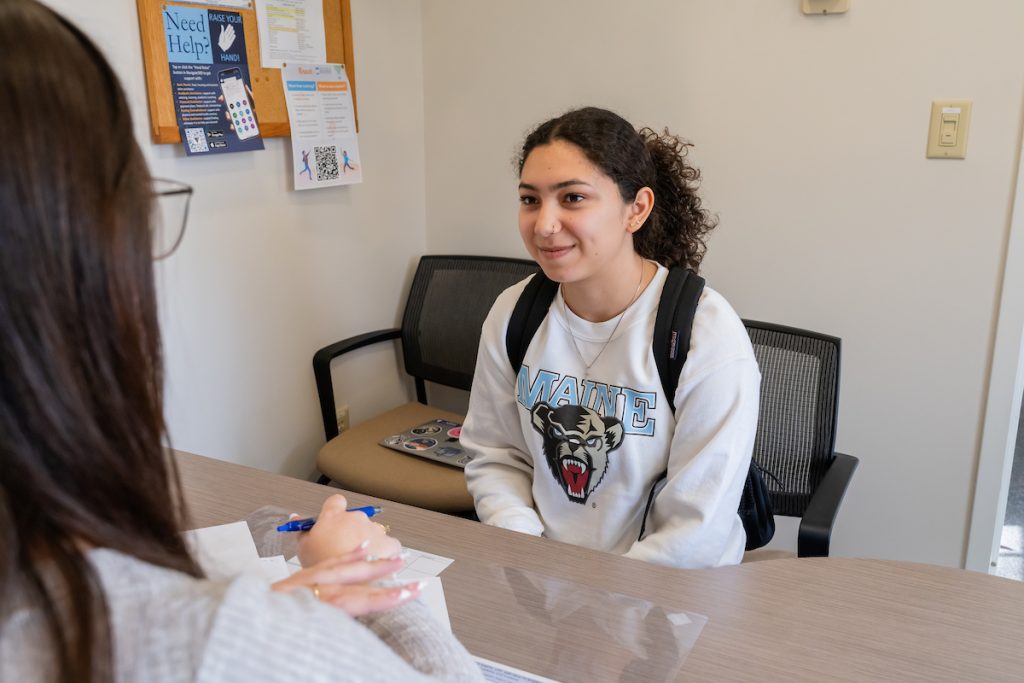 Photo of a student visiting the Academic Support Center.